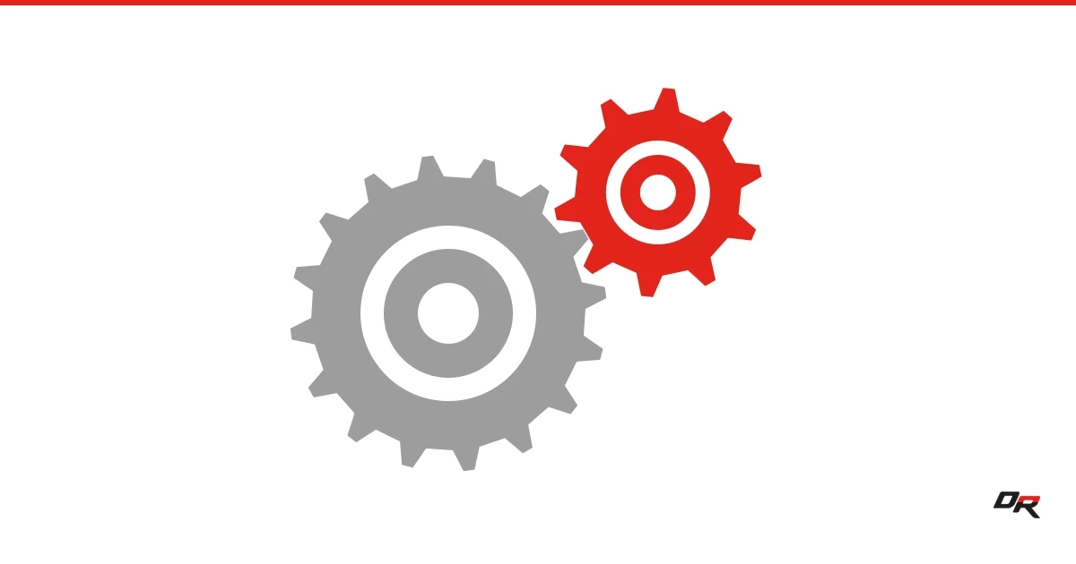 A large gray gear meshing with a smaller red gear on a white background.